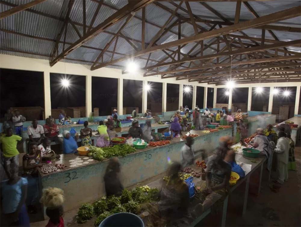 8 Busy night market in Msimba Tanzania illuminated with ceiling lights